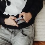 Closeup of teen using smartphone