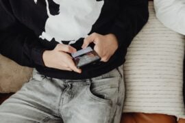 Closeup of teen using smartphone