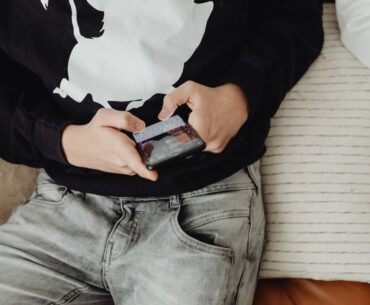 Closeup of teen using smartphone