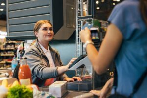 Cashier working at food store