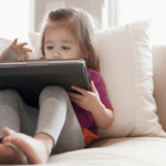 Toddler playing on iPad