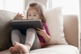Toddler playing on iPad