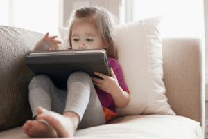 Toddler playing on iPad