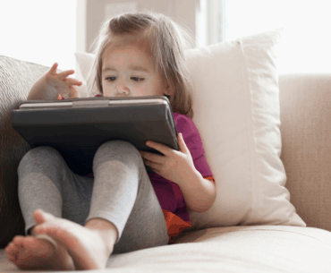 Toddler playing on iPad