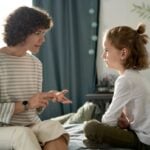 Parent having serious conversation with child