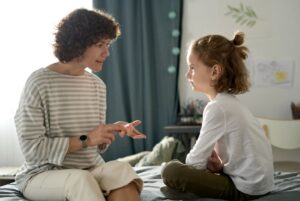 Parent having serious conversation with child