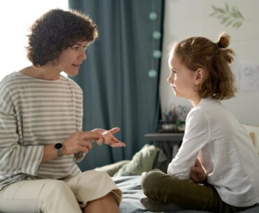 Parent having serious conversation with child