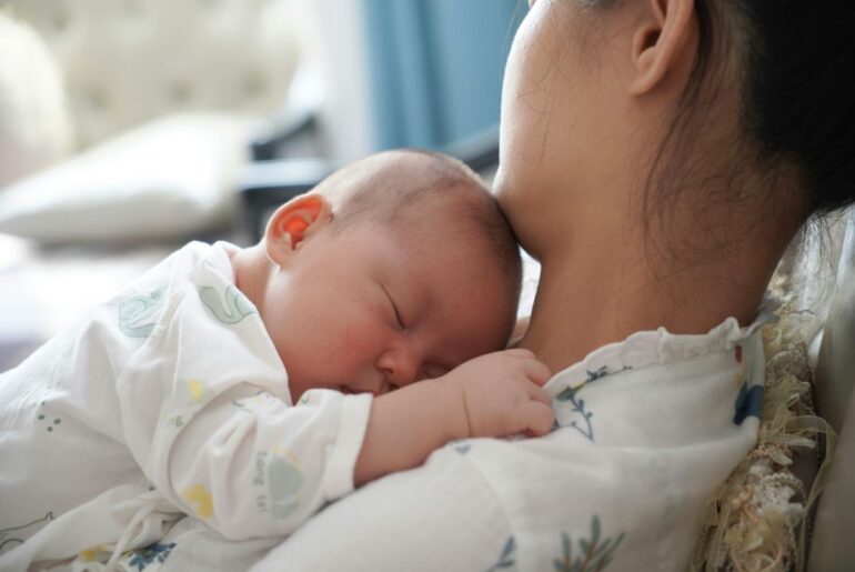 Mother holding newborn baby