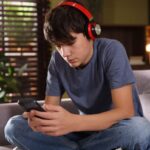 Teen boy looking at phone