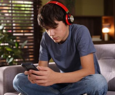 Teen boy looking at phone
