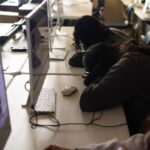 Students with heads down in class
