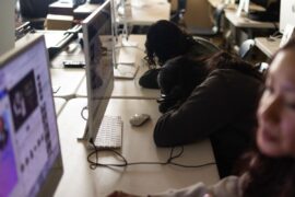 Students with heads down in class