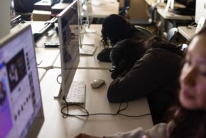 Students with heads down in class