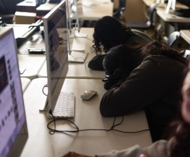 Students with heads down in class