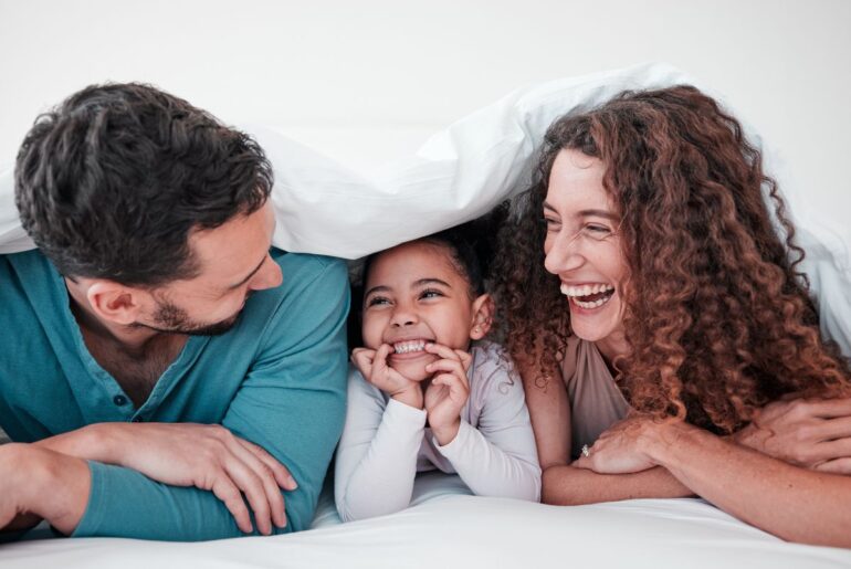 25 fun questions to add joy and connection to your day with kids Parents laughing and talking with child