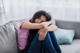 Depressed teen on couch