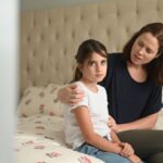 Mom comforting upset child