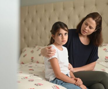 Mom comforting upset child